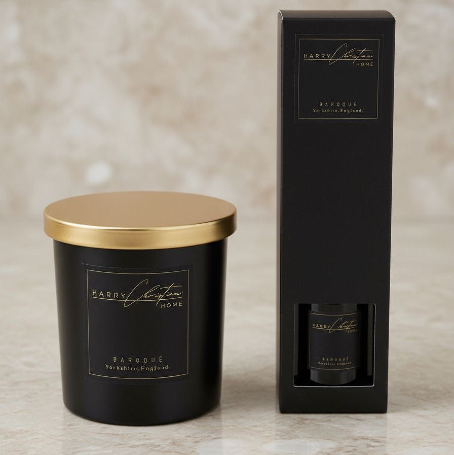 Harry Christian Home Black candle with gold lid and black and gold reed diffuser. Harry Christian Home Baroque Black and gold candle with Harry Christian Home Black and gold baroque reed diffuser
