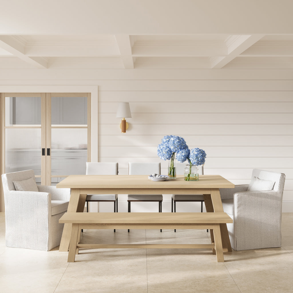 Harry Christian Home White Dining Chairs paired with our bulky Malibu dining armchairs and a wooden dining bench with a wooden table. Harry Christian Home Dining Chairs and Tables. 